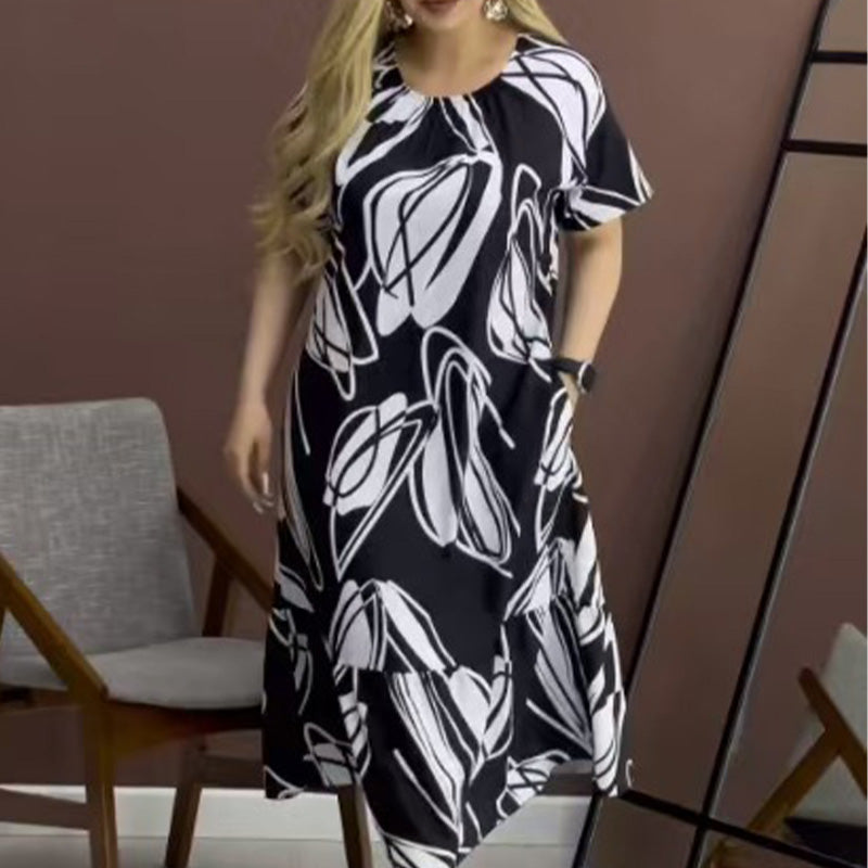 Elegantes, fließendes Kleid mit Rundhalsausschnitt und Print