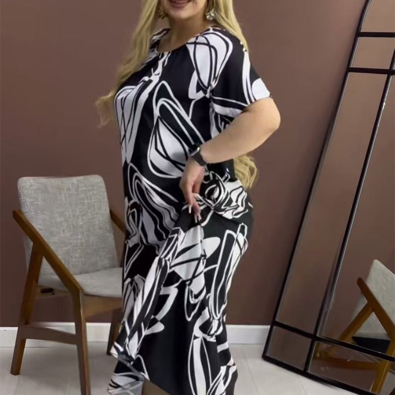 Elegantes, fließendes Kleid mit Rundhalsausschnitt und Print