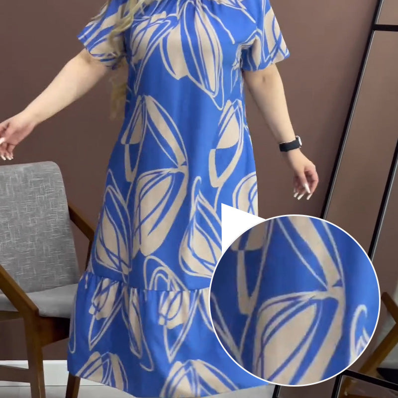 Elegantes, fließendes Kleid mit Rundhalsausschnitt und Print