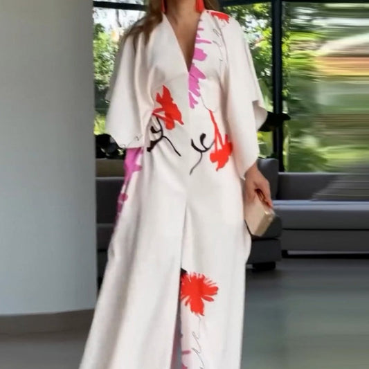 Jumpsuit mit V-Ausschnitt, Blumenmuster, unregelmäßigen Ärmeln und weitem Bein