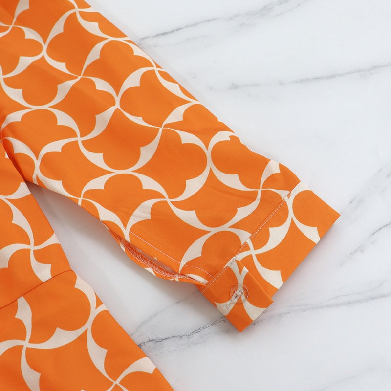 Trendiges orangefarbenes bedrucktes Damenkleid mit 3/4-Ärmeln
