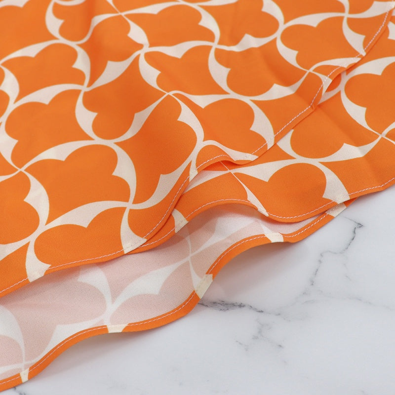 Trendiges orangefarbenes bedrucktes Damenkleid mit 3/4-Ärmeln