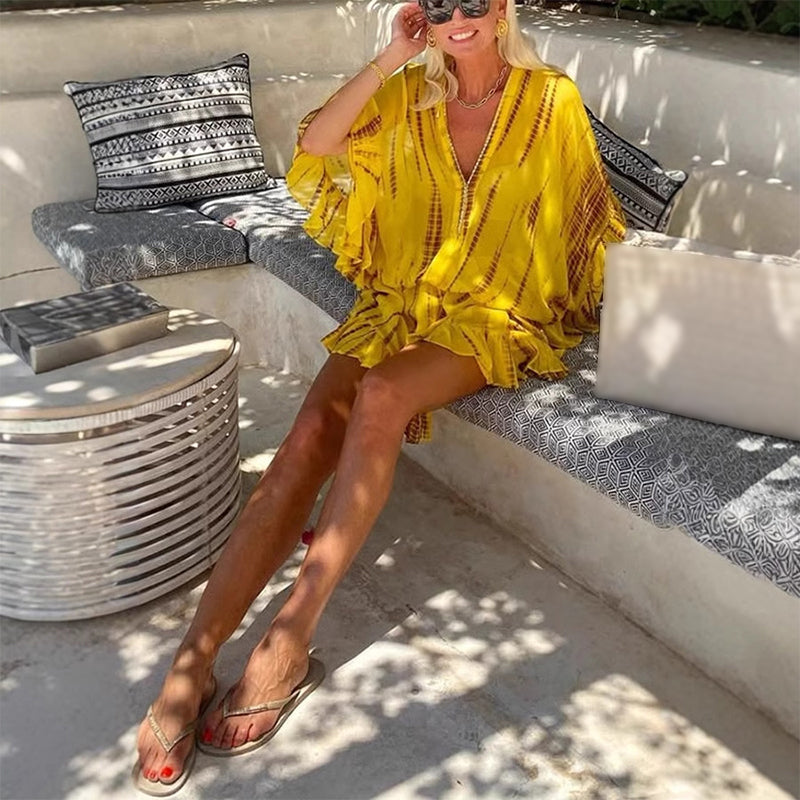 Gelbes, transparentes, seidiges Strandkleid mit tiefer Taille