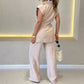 Elegantes Set aus tailliertem Oberteil und lässiger Hose