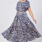 Trendy Damenkleid mit blauem Aufdruck, kurzärmlig, fließend und mit Gürtel