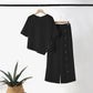 Zweiteiliges Damen-Set aus Top mit asymmetrischem Saum und Hose mit weitem Bein