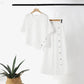 Zweiteiliges Damen-Set aus Top mit asymmetrischem Saum und Hose mit weitem Bein