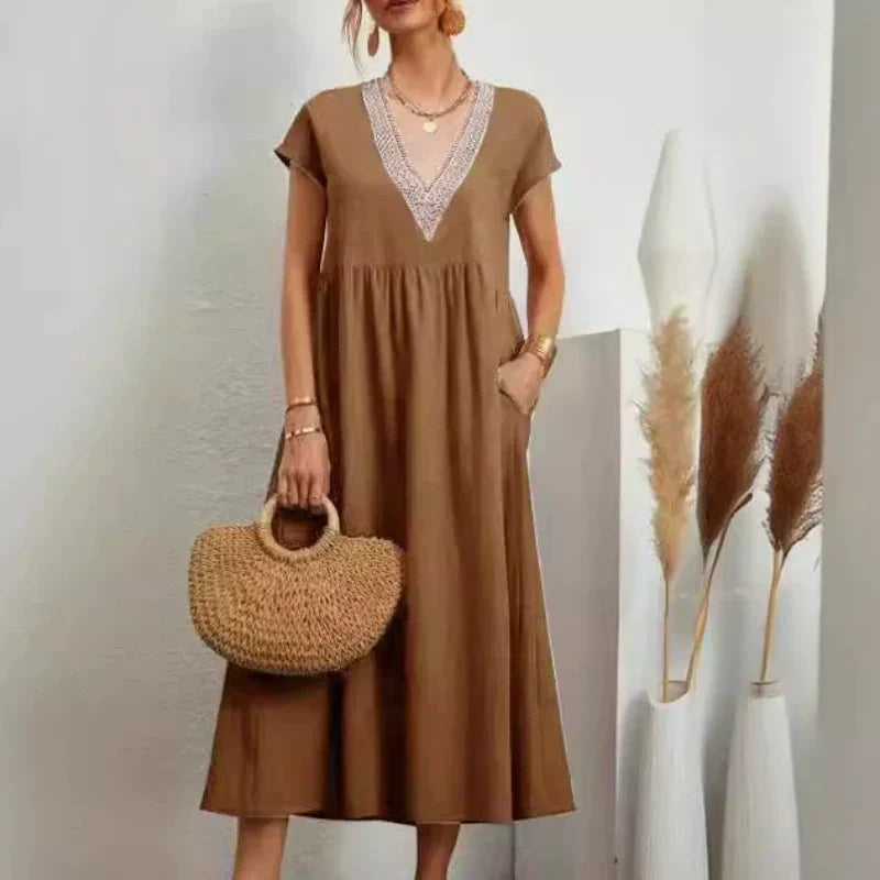 Elegantes Damenkleid mit V-Ausschnitt, kurzen Ärmeln und lockerer Passform