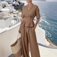 Set aus einem Wickeloberteil für Damen und einer Hose mit weitem Bein