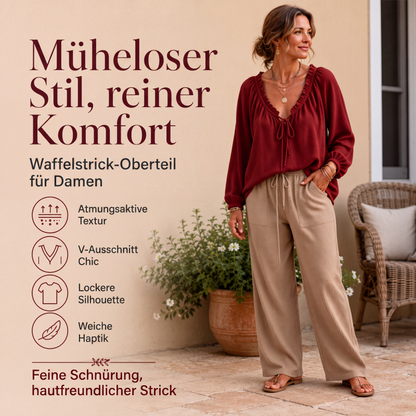 Locker sitzende Damenbluse mit Rüschen und Bindekragen